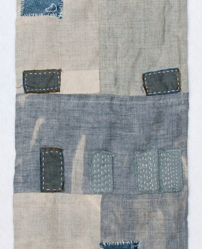 “Las Vegas Foreclosure Quilt”, 2011, 12" x 36" Recycled denim, wool, yarn and embroidery thread on bleached linen, copyright Kathryn Clark.