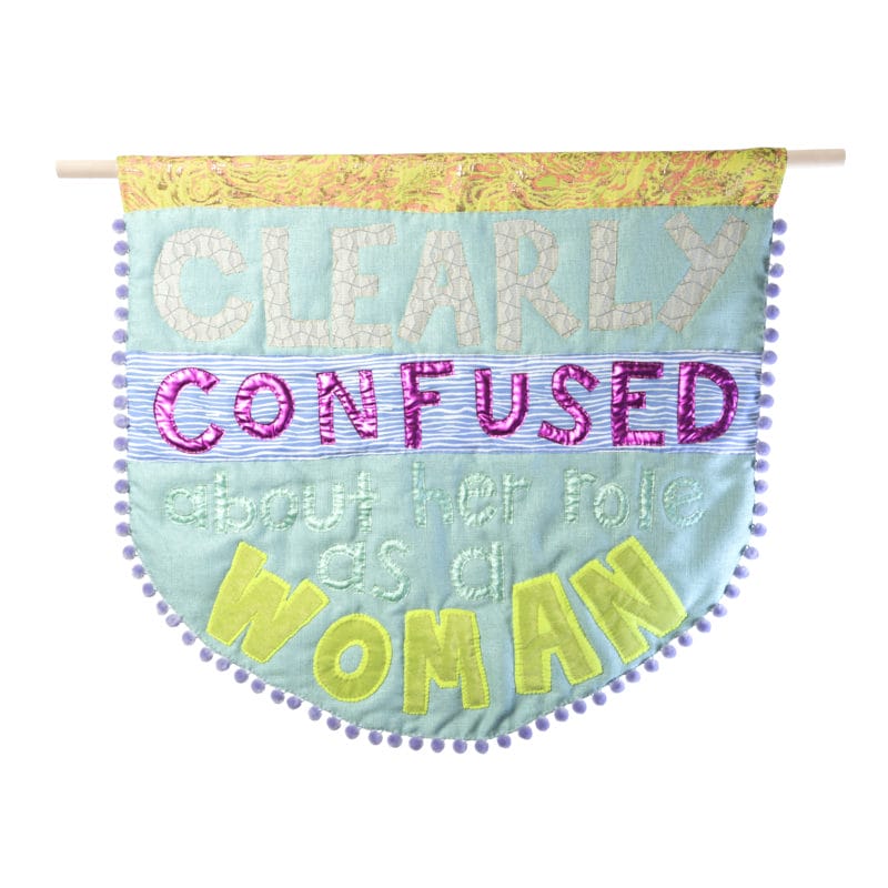 “Clearly Confused III” Alt Caps Series, fabric, polyfill& pompoms, 28 x 30 inches, 2018, copyright Natalie Baxter