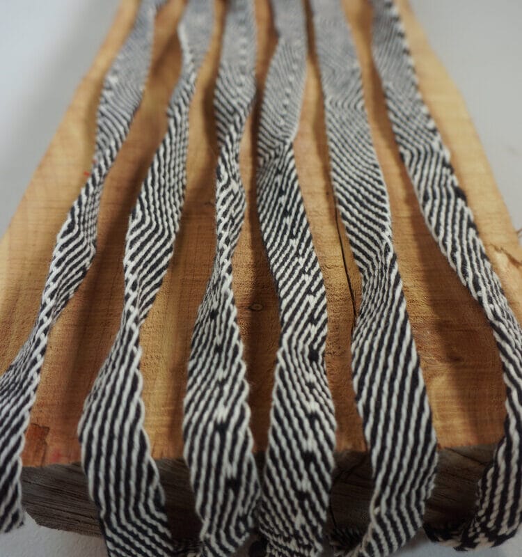“Drift – detail”, tablet weaving, found cedar plank, 2018, copyright Catherine Reinhart
