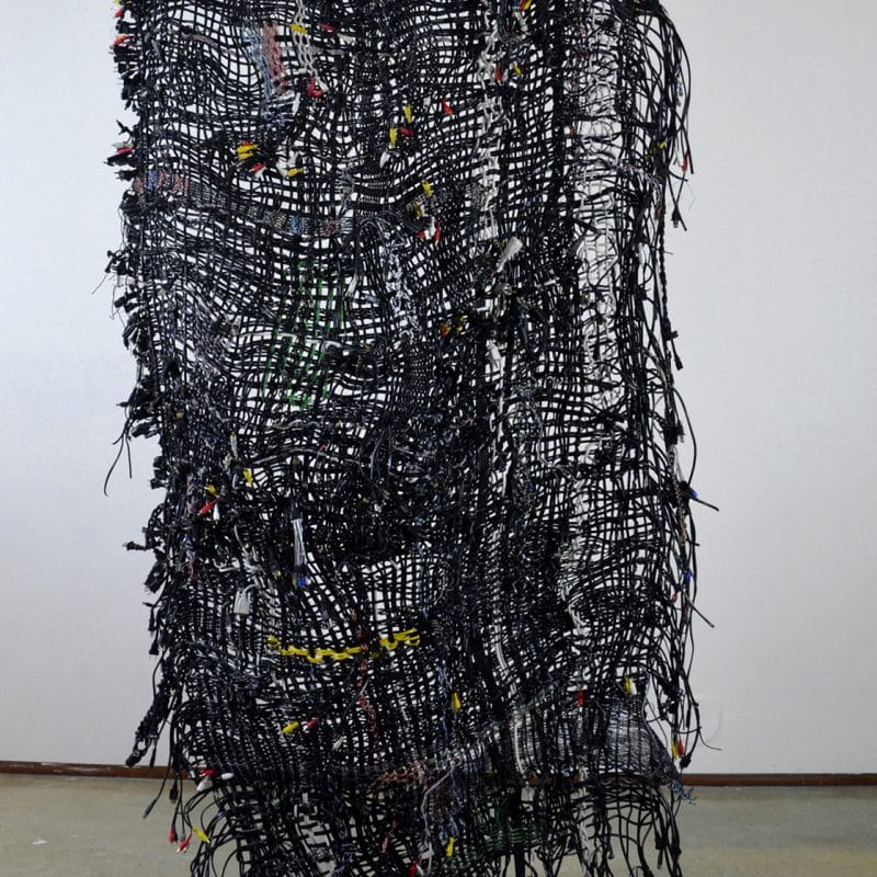 Fetter, 2013, 5’ X 12’ X 4". Wire weaving suspended in space. Giving the viewer a chance to interact with work. Photo cr. Melissa Haimowitz Clouse, copyright Peter Clouse