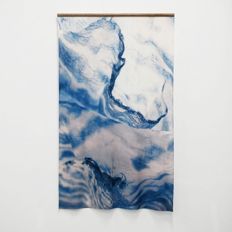Enfolded Sky #5, 2019. Digital print of indigo-dyed, salvaged textiles printed onto textiles made from recycled plastic bottles, recycled timber broom handle support, 87 (w) x 135cm (h), ph.cr. and copyright Rachael Wellisch