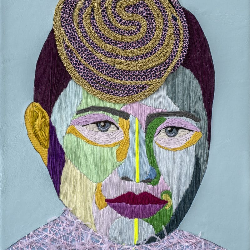 PWTYE #23. A composed portrait 33% Korean 33% Cuban 34% Danish. Hand embroidery and leather. copyright Preta Wolzak
