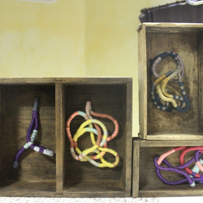 Tangled. Memories, secrets.   Year of realisation: 2019-2020.   Dimensions: 4 boxes dim. variable.   Technique: coiling (weaving off loom)   Materials: old antique drawers and boxes made of walnut and cherry wood, owned  maternal grandmother's property.  Threads: wool, silk, cotton, synthetic fibre.