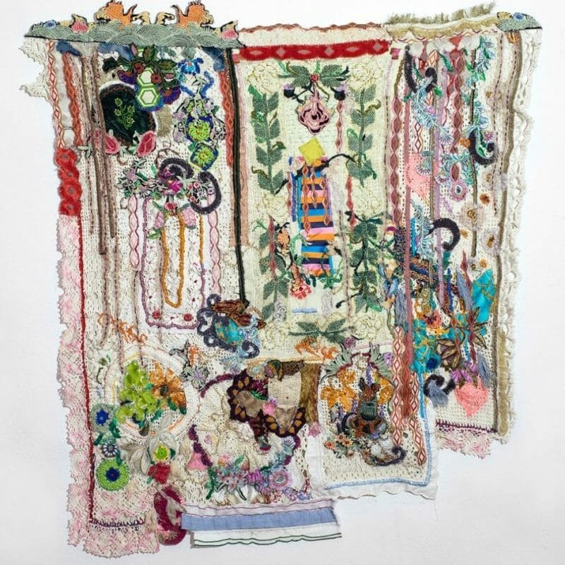 TORRE MAMUCHA (LINAJE) (MOMMY TOWER- LINEAGE). Hand embroidery and appliques of recovered small handmade crochet pieces, industrial and handmade embroideries on recovered crochet curtain, 103 X 110 cm, 2022 ph.cr. Ignacio Iasparra, copyright Lia Porto