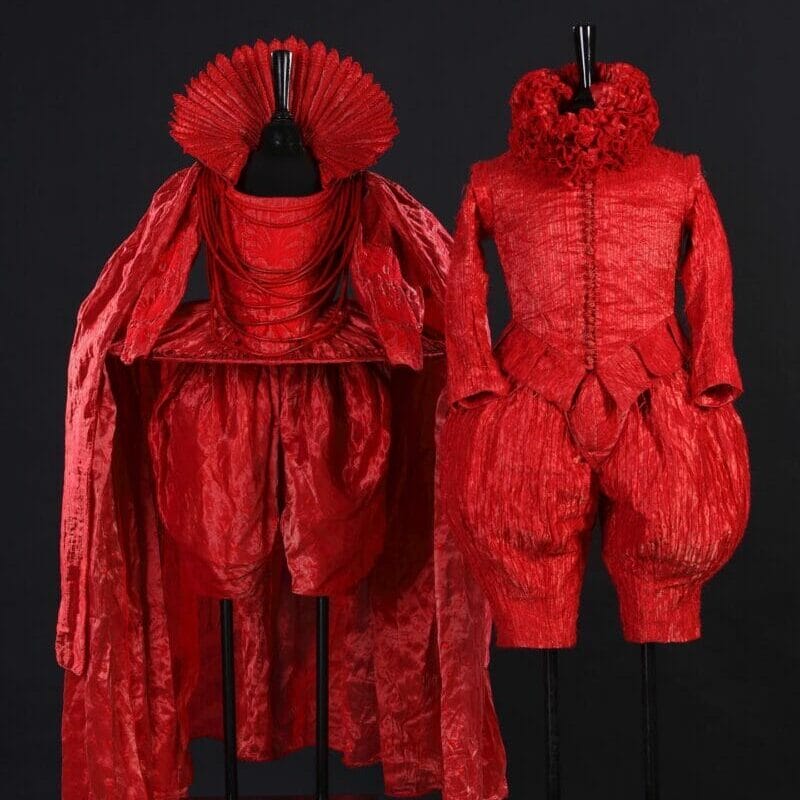 These two Red miniature costumes , Macbeth and Lady Macbeth, are made from an aluminium silk fabric . Both 110 cm high. From the Shakespeare Collection.# gallerie 238